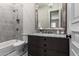 Elegant bathroom with marble shower, vanity, and bathtub at 3476 E Bartlett Pl, Chandler, AZ 85249