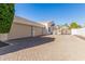 Three-car garage with paver driveway offering ample parking space at 3476 E Bartlett Pl, Chandler, AZ 85249