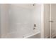 Clean bathroom with a bathtub and tiled walls at 35041 W Euclid Ave, Tonopah, AZ 85354