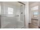 Modern bathroom with glass shower and white tile at 35041 W Euclid Ave, Tonopah, AZ 85354