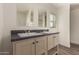 Clean bathroom with double vanity and dark countertop at 35041 W Euclid Ave, Tonopah, AZ 85354