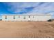 Rear view of a single-story home with a large yard at 35041 W Euclid Ave, Tonopah, AZ 85354