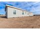 Side view of a single-story home with a large yard at 35041 W Euclid Ave, Tonopah, AZ 85354