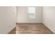 Bright hallway with wood-look floors and white walls at 35041 W Euclid Ave, Tonopah, AZ 85354