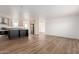 Modern kitchen with island, stainless steel appliances, and light cabinets at 35041 W Euclid Ave, Tonopah, AZ 85354