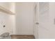 Laundry room with wood-look floors and white louvered doors at 35041 W Euclid Ave, Tonopah, AZ 85354