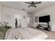 Main bedroom with a king-size bed and an ensuite bathroom at 390 S Verdad Ln, Casa Grande, AZ 85194