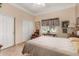 Bright bedroom with a queen-size bed, and ample closet space at 4055 N Recker Rd # 88, Mesa, AZ 85215