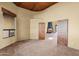 Room with tile floor, wood doors, and view of courtyard at 44622 N 20Th St, New River, AZ 85087