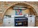 High-end kitchen features a blue range in a brick alcove at 50811 N 295Th Ave, Wickenburg, AZ 85390