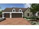 Three-car garage with dark brown doors at 5227 N 70Th Pl, Paradise Valley, AZ 85253