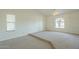 Spacious bedroom with large window and ceiling fan at 669 E Linda Ln, Gilbert, AZ 85234