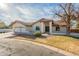 House exterior with a two-car garage and front yard at 669 E Linda Ln, Gilbert, AZ 85234