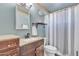 Clean bathroom with a vanity, toilet and shower/tub combo at 780 W Monterey St, Chandler, AZ 85225