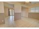 Dining room with tiled floors, a ceiling fan, and an open view into the living area at 8961 W Century Dr, Arizona City, AZ 85123