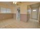 Dining room with tile flooring, ceiling fan, and view of the kitchen at 8961 W Century Dr, Arizona City, AZ 85123