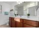 Bathroom boasts double vanity and a large mirror at 931 W Cedar Tree Dr, San Tan Valley, AZ 85143