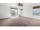Spacious bedroom with sliding door access to backyard at 931 W Cedar Tree Dr, San Tan Valley, AZ 85143