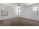 Well-lit bedroom with neutral walls and carpeting at 931 W Cedar Tree Dr, San Tan Valley, AZ 85143