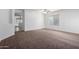 Living room with access to the kitchen and backyard at 931 W Cedar Tree Dr, San Tan Valley, AZ 85143