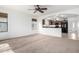 Living room with a view of the kitchen and backyard at 931 W Cedar Tree Dr, San Tan Valley, AZ 85143