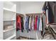 Large walk-in closet with shelves and hanging rods at 9446 W Sells Dr, Phoenix, AZ 85037