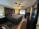 Spacious bedroom with king-size bed and ceiling fan at 11411 N 91St Ave # 29, Peoria, AZ 85345