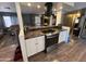 Open concept kitchen with island, granite countertops, and stainless steel appliances at 11411 N 91St Ave # 29, Peoria, AZ 85345