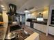 Bright kitchen featuring white cabinets, granite countertops and stainless steel appliances at 11411 N 91St Ave # 29, Peoria, AZ 85345