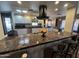 Kitchen island with dark countertop and breakfast bar seating at 11411 N 91St Ave # 29, Peoria, AZ 85345