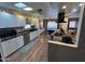 Bright kitchen featuring white cabinets, granite countertops, and a breakfast bar at 11411 N 91St Ave # 29, Peoria, AZ 85345