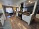 Updated kitchen featuring white cabinets, granite countertops, and stainless steel appliances at 11411 N 91St Ave # 29, Peoria, AZ 85345