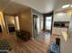 Kitchen with stainless steel refrigerator and access to other rooms at 11411 N 91St Ave # 29, Peoria, AZ 85345