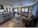 Open living room and kitchen area with hardwood floors at 11411 N 91St Ave # 29, Peoria, AZ 85345