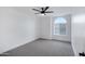 Spacious bedroom with grey carpet and arched window at 1418 S Almar Cir, Mesa, AZ 85204