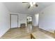 Living room with laminate flooring and view into kitchen at 17200 W Bell Rd # 1745, Surprise, AZ 85374