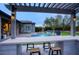 View of the pool and backyard from the outdoor kitchen at 19198 N 95Th Pl, Scottsdale, AZ 85255