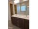 Modern bathroom with double vanity and large mirror at 21018 E Calle Luna Ct, Queen Creek, AZ 85142