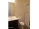 Bathroom with shower, toilet, and dark vanity at 21018 E Calle Luna Ct, Queen Creek, AZ 85142