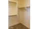 Spacious walk-in closet with shelves and hanging rods at 21018 E Calle Luna Ct, Queen Creek, AZ 85142