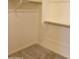 Walk-in closet with shelves and hanging rods at 21018 E Calle Luna Ct, Queen Creek, AZ 85142