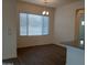 Bright dining area with hardwood floors and window blinds at 21018 E Calle Luna Ct, Queen Creek, AZ 85142