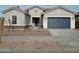 One-story house with a two-car garage and desert landscaping at 21018 E Calle Luna Ct, Queen Creek, AZ 85142