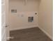 Simple laundry room with hookups and vinyl flooring at 21018 E Calle Luna Ct, Queen Creek, AZ 85142