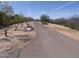 Paved walking path with a bench and desert landscape at 21018 E Calle Luna Ct, Queen Creek, AZ 85142