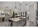 Modern kitchen with an island, granite countertops, and gray cabinets at 22811 E Stacey Rd, Queen Creek, AZ 85142