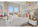 Charming bedroom with white bedding and colorful accents at 26032 S 229Th Pl, Queen Creek, AZ 85142