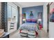 Blue and red-themed bedroom with train decor at 26032 S 229Th Pl, Queen Creek, AZ 85142