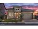 Stunning craftsman style home with a two-car garage and landscaped front yard at 26032 S 229Th Pl, Queen Creek, AZ 85142