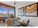 Spacious home office with wood desk and large windows at 26032 S 229Th Pl, Queen Creek, AZ 85142